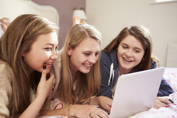 According to a new survey, 86% of teenagers who spend time online, spend it here. Where is it?
